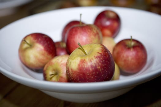 White pottery with red apples