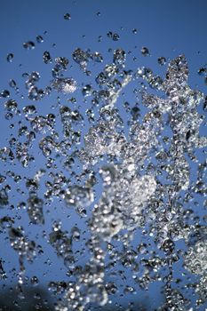 Close up view of a high speed capture of a burst of water drops.