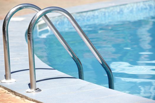 Handrail of the public swimming pool. Horizontal photo