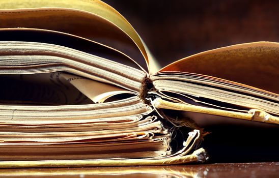 Old papers and books on a dark background