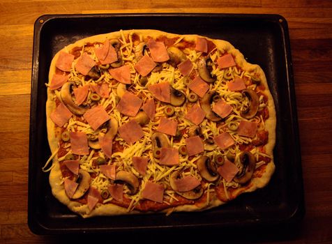 Tray with freshly made pizza