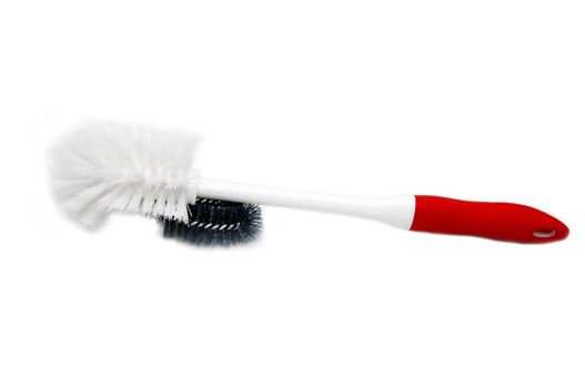 round brush for a toilet bowl with a red pen on a white background