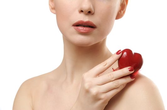 Beautiful woman holding red heart. Face closeup. Isolated on white background