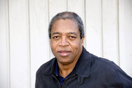 African american male posing outside.