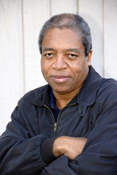 African american male posing outside.