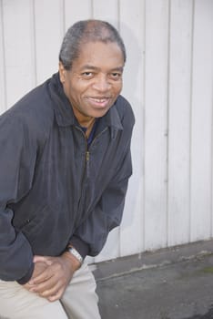 African american male posing outside.