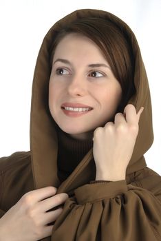 Cheerful young woman holding her hood