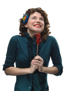 Young woman holding her lollipop
