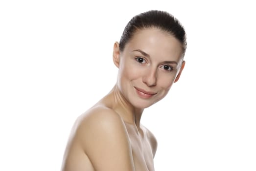 Portrait of young beautiful serene girl with healthy complexion. Isolated on white background