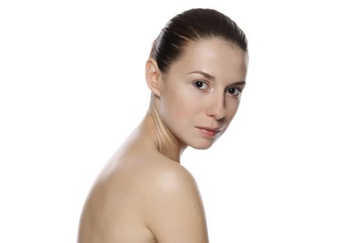 Portrait of young beautiful serene girl with healthy complexion. Isolated on white background