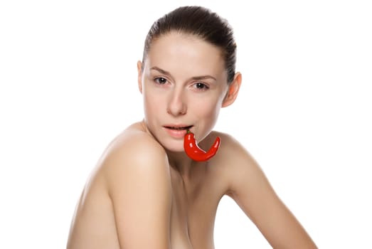 Portrait of a beautiful woman with chili pepper. Isolated on white background