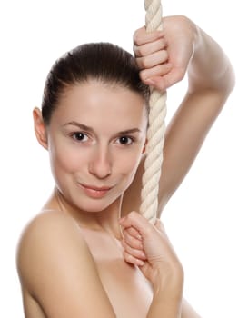 Portrait of young beautiful woman with a thick rope. Isolated on white background