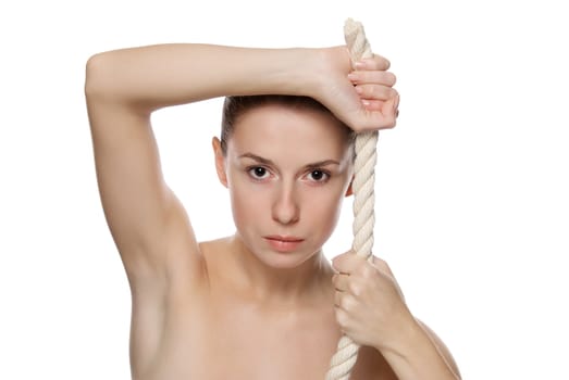 Portrait of young beautiful woman with a thick rope. Isolated on white background