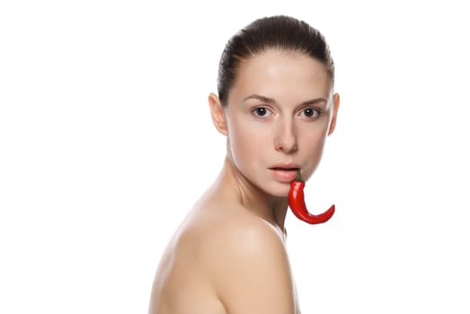 Portrait of a beautiful woman with chili pepper. Isolated on white background