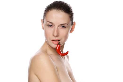 Portrait of a beautiful woman with chili pepper. Isolated on white background