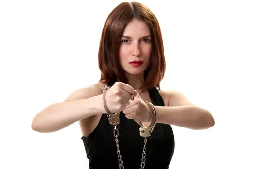 Young saxy brunette in handcuffs isolated on white background