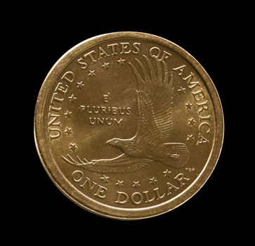 Macro front view of the eagle on a USA one dollar coin isolated against black