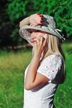 A beautiful young woman on a cell phone.