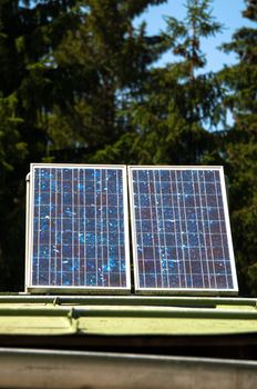 Rural mountain cabin with solar panels to ensure basic electricity off-site in the Bavarian Alps