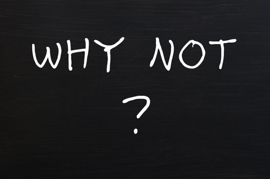 Why not - question written with chalk on a wooden blackboard background