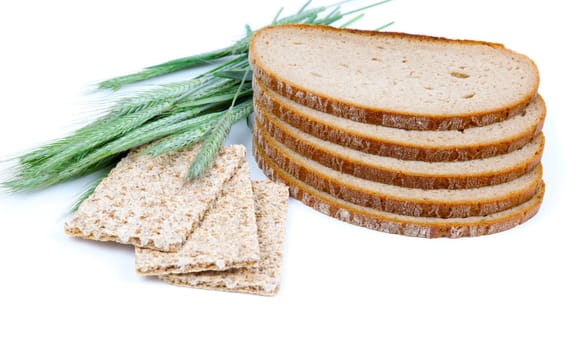 tasty baked bread, crispbread, ears and wheat grain, isolated on a white background