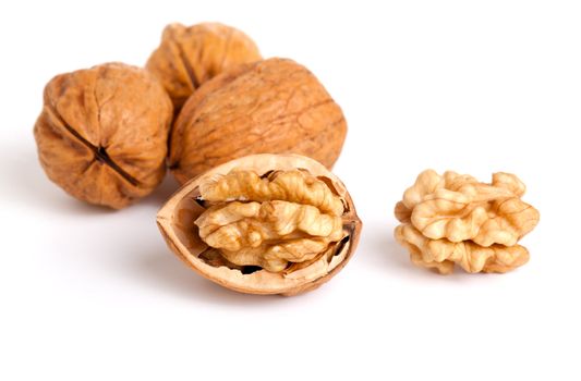 walnut and a cracked walnut isolated on the white background