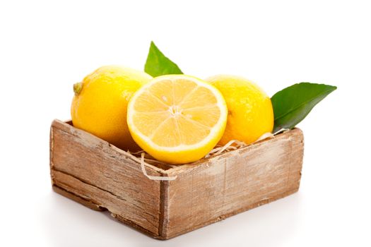 yellow lemon with green leaves,  on white background.