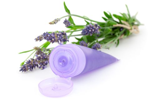 Lavender soothing cream tube and lavender flower, isolated on white background