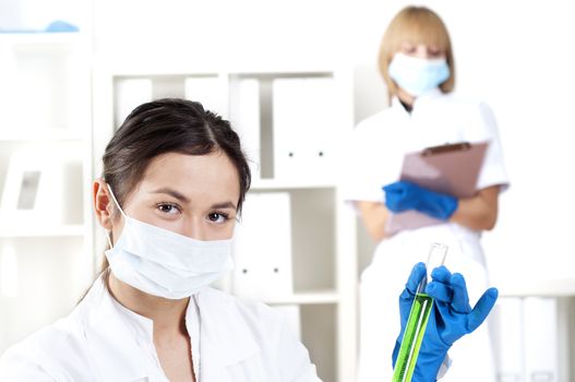 group of scientists working in laboratories with equipment