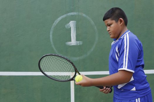 Thai boy tennis player learning how to preparing to play tennis