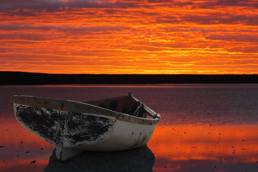 Montage of boat against sunset