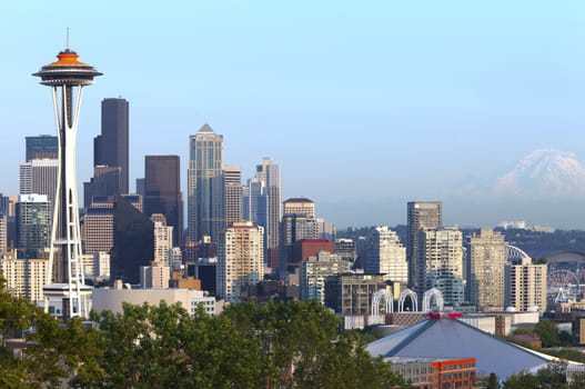 Seattle skyline at sunset and Mt.Rainier.