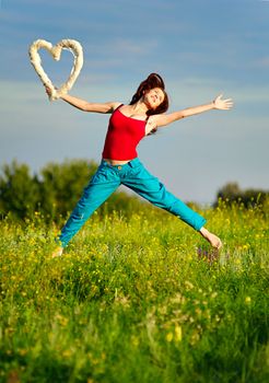 Sport woman running on a sunset field