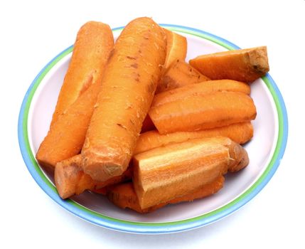 boiled carrots on dish over white background