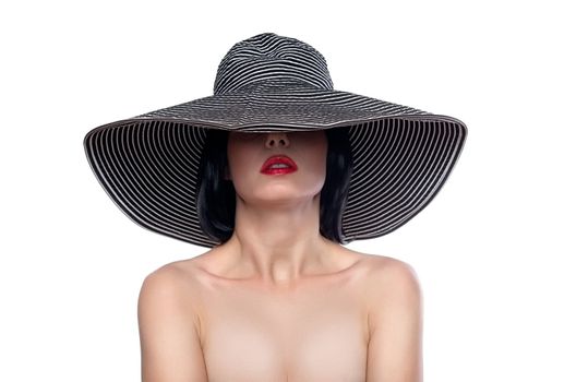 Elegant female portrait wearing wide brim hat over eyes isolated on white