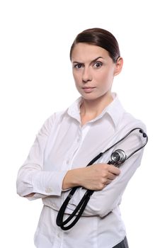 Portrait of a displeased medical doctor woman with stethoscope isolated on white