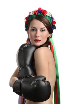 Topless girl with boxing gloves and floral wreath on her head isolated on white background