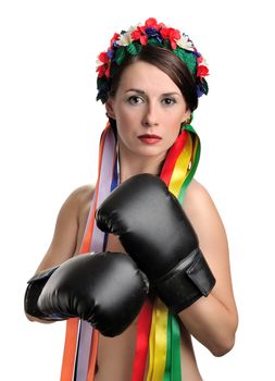 Topless girl with boxing gloves and floral wreath on her head isolated on white background