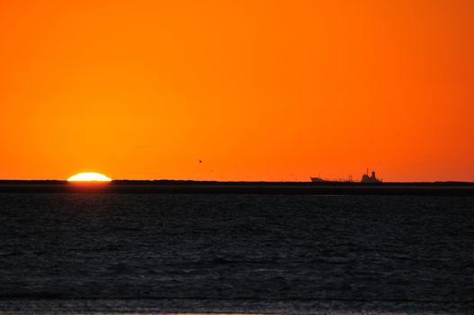 Ship silhouette against sunset at Walvisbaai, Namibia