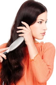 pretty woman combing hair, isolated on white background