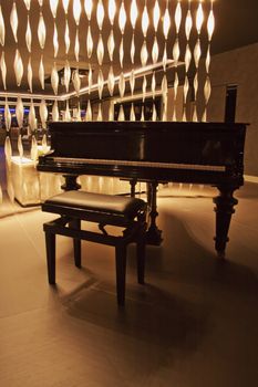 An elegant black piano in a lobby