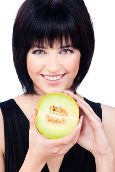 Pretty smiled girl holding slice of melon, isolated on white background