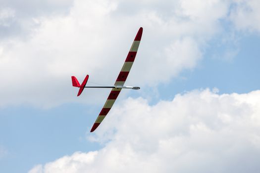 RC glider flying in the blue sky, closeup