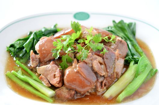 stewed pork knuckle with kale inside , chinese cuisine