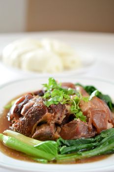 stewed pork knuckle with kale and chinese bun
