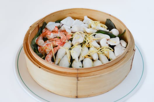 steamed seafood in a bamboo basket