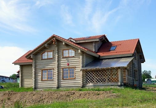 The wooden house on a background of the  sky