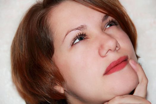 Portrait of beautiful girl with glance upwards
