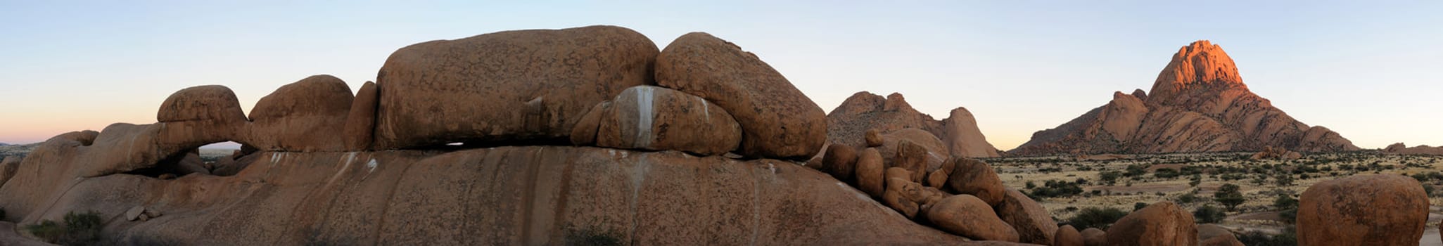 Panorama from eleven photos of the natural arch and Spitzkoppe in Namibia