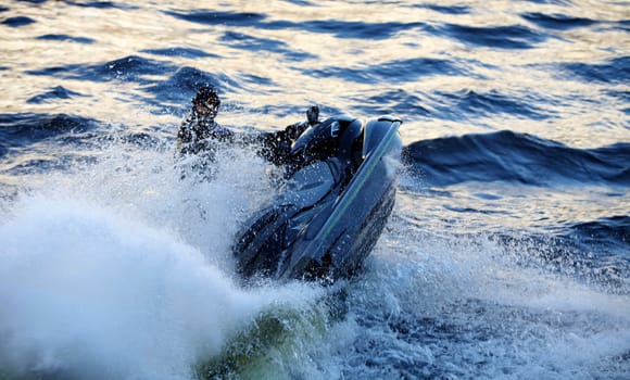 seadoo  at high speed lifts a large wave